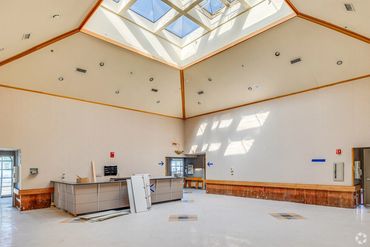 Interior lounge with skylight and wooden beams