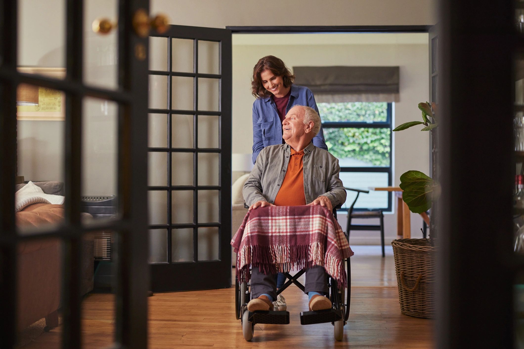 Caregiver with elderly patient in wheelchair